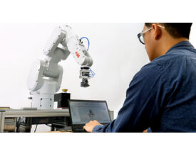A human interacting with the ABB IRB 1300 robot, demonstrating its precision, speed, and seamless integration in industrial workflows. A human interacting with the ABB IRB 1300 robot, demonstrating its precision, speed, and seamless integration in industrial workflows.